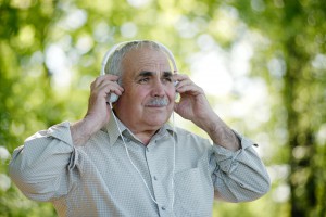 Senior man concentrating on his music